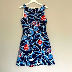 Dress with a small tear on the front side that is shown on the picture.